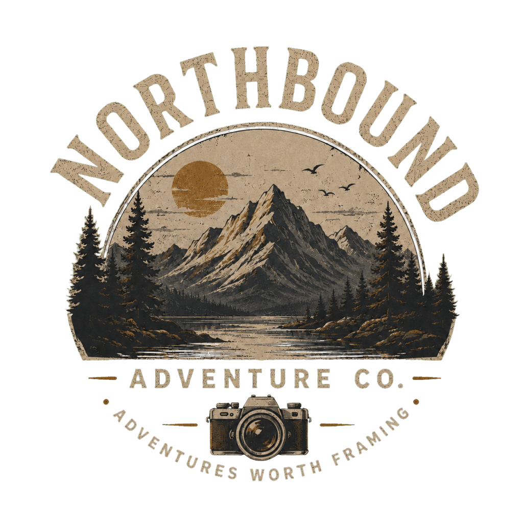 Logo for Northbound Adventure Co, featuring mountains, trees, and a sunset, with a camera icon